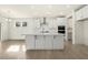 Bright, modern kitchen features a large island, stainless steel appliances, and ample cabinet space at 25 Long Needle Ct # 37, Youngsville, NC 27596