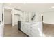 Bright, modern kitchen features a large island with seating, stainless steel appliances, and ample cabinet space at 25 Long Needle Ct # 37, Youngsville, NC 27596