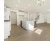 Kitchen boasts white cabinets, stainless steel appliances, and a center island at 25 Long Needle Ct # 37, Youngsville, NC 27596
