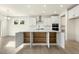Bright, modern kitchen features a large island with storage, stainless steel appliances, and ample cabinet space at 25 Long Needle Ct # 37, Youngsville, NC 27596