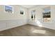 Bright, open living space with hardwood flooring, large windows, and classic trim at 25 Long Needle Ct # 37, Youngsville, NC 27596