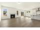 Open concept living room offers a fireplace and access to the kitchen at 25 Long Needle Ct # 37, Youngsville, NC 27596