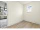 This room features neutral walls, a window, and light wood-look laminate flooring at 25 Long Needle Ct # 37, Youngsville, NC 27596