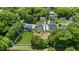 Aerial view of a home nestled among lush greenery, showcasing its peaceful neighborhood setting at 2521 Newbold St, Raleigh, NC 27603