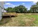 Large backyard featuring a wooden fence and a deck, perfect for outdoor activities at 2521 Newbold St, Raleigh, NC 27603