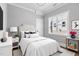 Cozy bedroom with an upholstered headboard, soft white bedding, and coordinating bedside tables at 2521 Newbold St, Raleigh, NC 27603