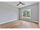 Bright bedroom with hardwood floors, ceiling fan, and a large window offering ample natural light at 2521 Newbold St, Raleigh, NC 27603