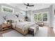 Serene bedroom features large windows, hardwood floors, and a seating area at 2521 Newbold St, Raleigh, NC 27603