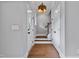 A spacious entryway features hardwood floors, white trim, and a modern light fixture at 2521 Newbold St, Raleigh, NC 27603