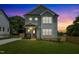 Charming two-story home with a well-manicured lawn, showcasing its inviting facade at twilight at 2521 Newbold St, Raleigh, NC 27603