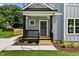 Close-up of the inviting front porch with a well-manicured lawn and charming details at 2521 Newbold St, Raleigh, NC 27603