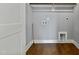 Finished laundry room with washer/dryer hookups, hardwood flooring, and fresh paint at 2521 Newbold St, Raleigh, NC 27603