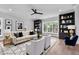 Stylish living room featuring built-in shelving, a large window, and neutral decor at 2521 Newbold St, Raleigh, NC 27603