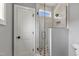 Glass shower with tiled walls and stylish fixtures, complemented by a mosaic floor at 2521 Newbold St, Raleigh, NC 27603