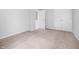 Comfortable bedroom with neutral carpet, closet space, and a well-lit atmosphere at 2705 Ramblegate Ln, Durham, NC 27705