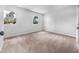 Inviting bedroom with natural light and neutral carpeting, creating a calming ambiance at 2705 Ramblegate Ln, Durham, NC 27705