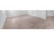 Well-lit bedroom with neutral carpeting and a closet, ideal for storage solutions at 2705 Ramblegate Ln, Durham, NC 27705