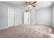 Spacious bedroom featuring neutral carpeting and a ceiling fan, perfect for relaxation at 2705 Ramblegate Ln, Durham, NC 27705