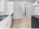 Well-lit kitchen with ample cabinet space, modern sink, and a view into the next room at 2705 Ramblegate Ln, Durham, NC 27705