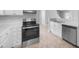 Modern kitchen featuring stainless steel appliances, sleek cabinetry, and a functional layout at 2705 Ramblegate Ln, Durham, NC 27705