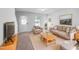 Bright living room featuring modern furniture, fresh paint and a front door that lets in a lot of light at 2705 Ramblegate Ln, Durham, NC 27705