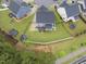 Aerial view of a private backyard with lush green grass and well-maintained landscaping at 2909 Landon Pines Ct, New Hill, NC 27562