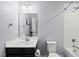 Clean bathroom with a modern vanity, tiled shower, and bright lighting at 2909 Landon Pines Ct, New Hill, NC 27562