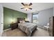 Stylish bedroom with a modern bed, ample natural light, and green accent wall at 2909 Landon Pines Ct, New Hill, NC 27562