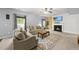 Inviting living room with a fireplace, ceiling fan, and natural light at 2909 Landon Pines Ct, New Hill, NC 27562