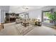 Open-concept living room flowing into a kitchen with ample seating at 2909 Landon Pines Ct, New Hill, NC 27562