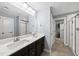 Bright main bathroom with dual sinks and a large walk-in closet at 2909 Landon Pines Ct, New Hill, NC 27562