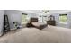 Spacious main bedroom with large windows and coordinating furniture at 2909 Landon Pines Ct, New Hill, NC 27562