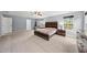 Large main bedroom suite with natural light and neutral decor at 2909 Landon Pines Ct, New Hill, NC 27562