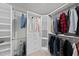 Organized walk-in closet with shelving and hanging storage at 2909 Landon Pines Ct, New Hill, NC 27562