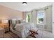 Cozy bedroom with a comfortable bed, soft lighting, and a decorative rug at 300 Quarryrock Road Rd, Holly Springs, NC 27540