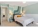 Stylish bedroom with a unique painted accent wall and comfortable furnishings at 300 Quarryrock Road Rd, Holly Springs, NC 27540