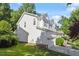 Exterior view of a well-maintained house with a two-car garage and a nice front lawn at 300 Quarryrock Road Rd, Holly Springs, NC 27540