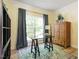 Cozy home office featuring a desk, shelving, a large window, and natural light at 300 Quarryrock Road Rd, Holly Springs, NC 27540