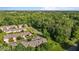 Neighborhood aerial shows lush green trees surrounding well-maintained suburban homes with manicured lawns at 3027 Maple Ave # U1, Burlington, NC 27215