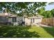 Beautiful backyard featuring a patio, outdoor seating, manicured landscaping and partial shade at 3027 Maple Ave # U1, Burlington, NC 27215