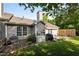 Well-maintained backyard featuring a patio, grill, storage and partial shade from mature trees at 3027 Maple Ave # U1, Burlington, NC 27215