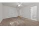 This well-lit bedroom offers neutral carpet, generous closet space, and an ensuite bathroom at 3027 Maple Ave # U1, Burlington, NC 27215