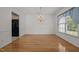 Formal dining room features a chandelier and hardwood floors at 3027 Maple Ave # U1, Burlington, NC 27215