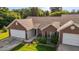 A beautiful brick home with well-manicured landscaping, a two-car garage, and inviting curb appeal at 3027 Maple Ave # U1, Burlington, NC 27215