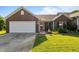 Charming brick home with a two-car garage, landscaped lawn, and inviting front porch at 3027 Maple Ave # U1, Burlington, NC 27215