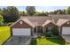 Well-maintained brick home with a two-car garage, landscaped lawn, and welcoming front entrance at 3027 Maple Ave # U1, Burlington, NC 27215
