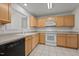 Well-lit kitchen features ample cabinetry and modern appliances at 3027 Maple Ave # U1, Burlington, NC 27215