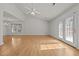 Bright living room featuring vaulted ceiling, new floors, large window and access to the backyard at 3027 Maple Ave # U1, Burlington, NC 27215