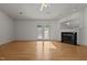 Sun-filled living room with fireplace and access to the backyard at 3027 Maple Ave # U1, Burlington, NC 27215