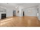 Bright, spacious living room with hardwood floors and a fireplace at 3027 Maple Ave # U1, Burlington, NC 27215